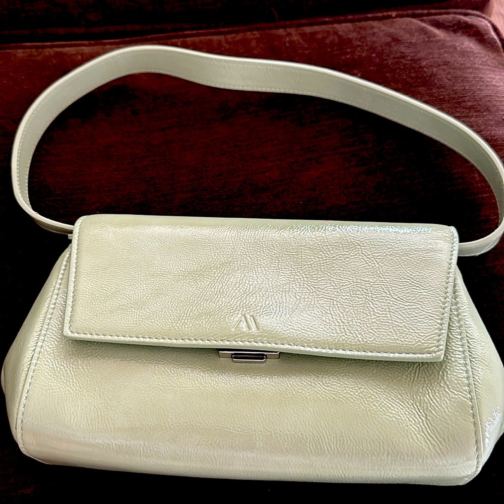 Sage green bag with crossbody strap! Full set with dustbag. Lined in blue suede.